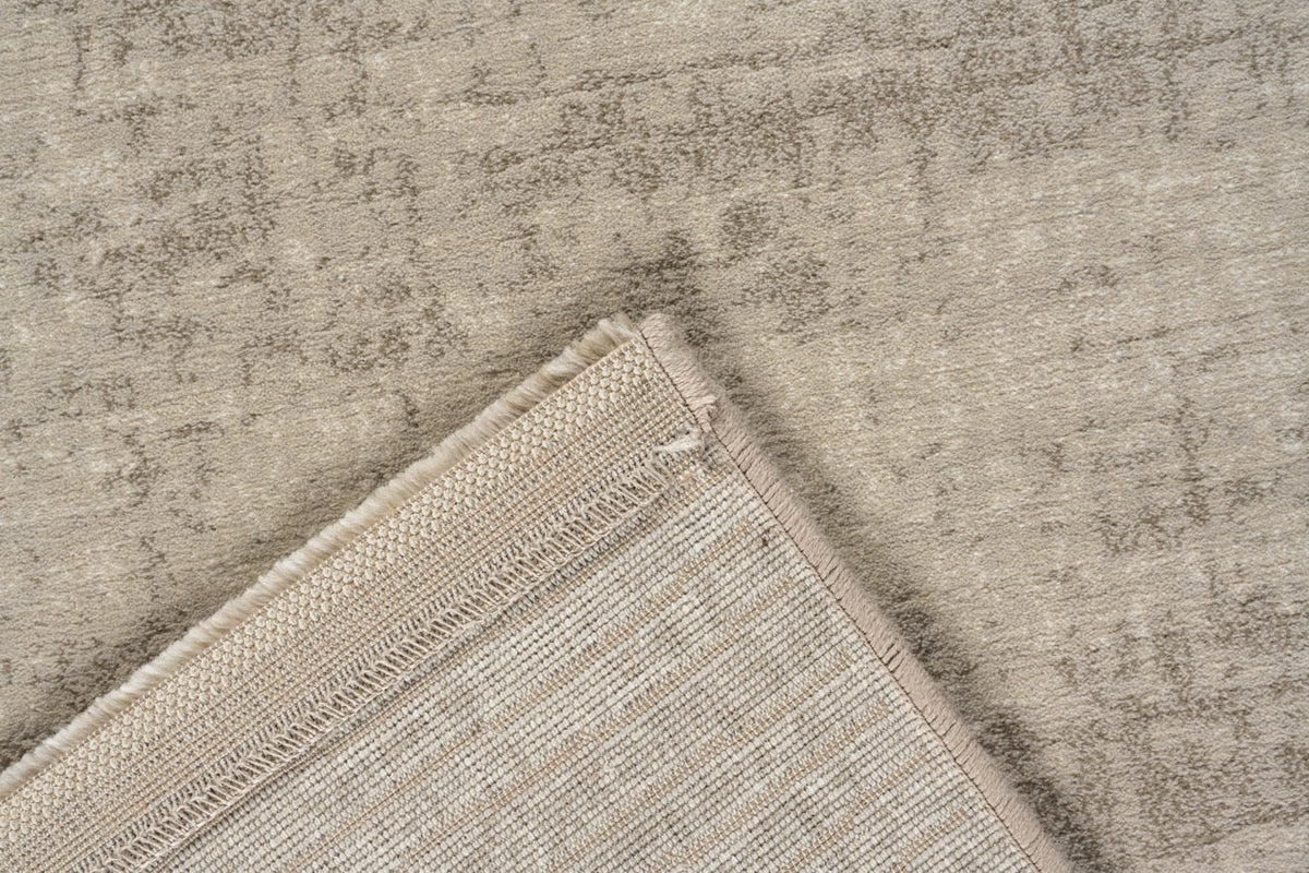 Tapis ras beige sable Tapison Home Torino, détail