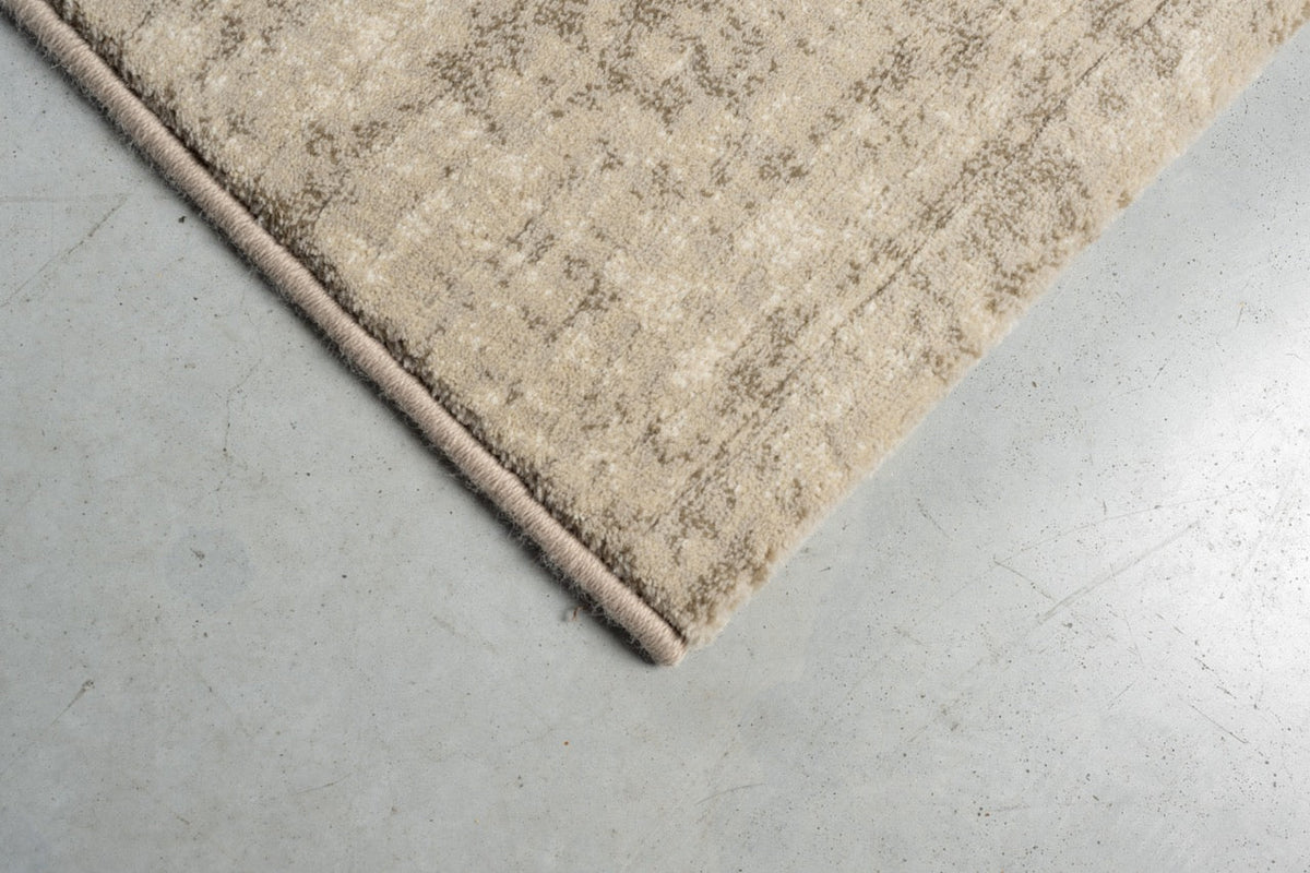 Tapis ras beige sable Tapison Home Torino, détail