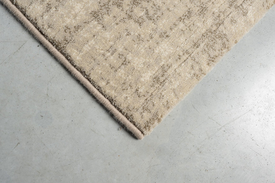 Tapis ras beige sable Tapison Home Torino, détail