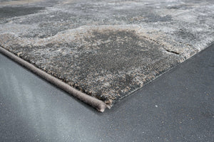 Détail d'un angle du tapis Tapison Home Torino 063.0934.3293 en gris, sable et taupe