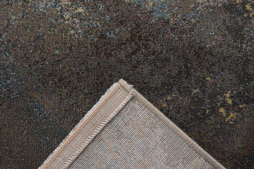 Coin replié montrant l'envers tissé du tapis multicolore Tapison Home Torino 063.0934.7270