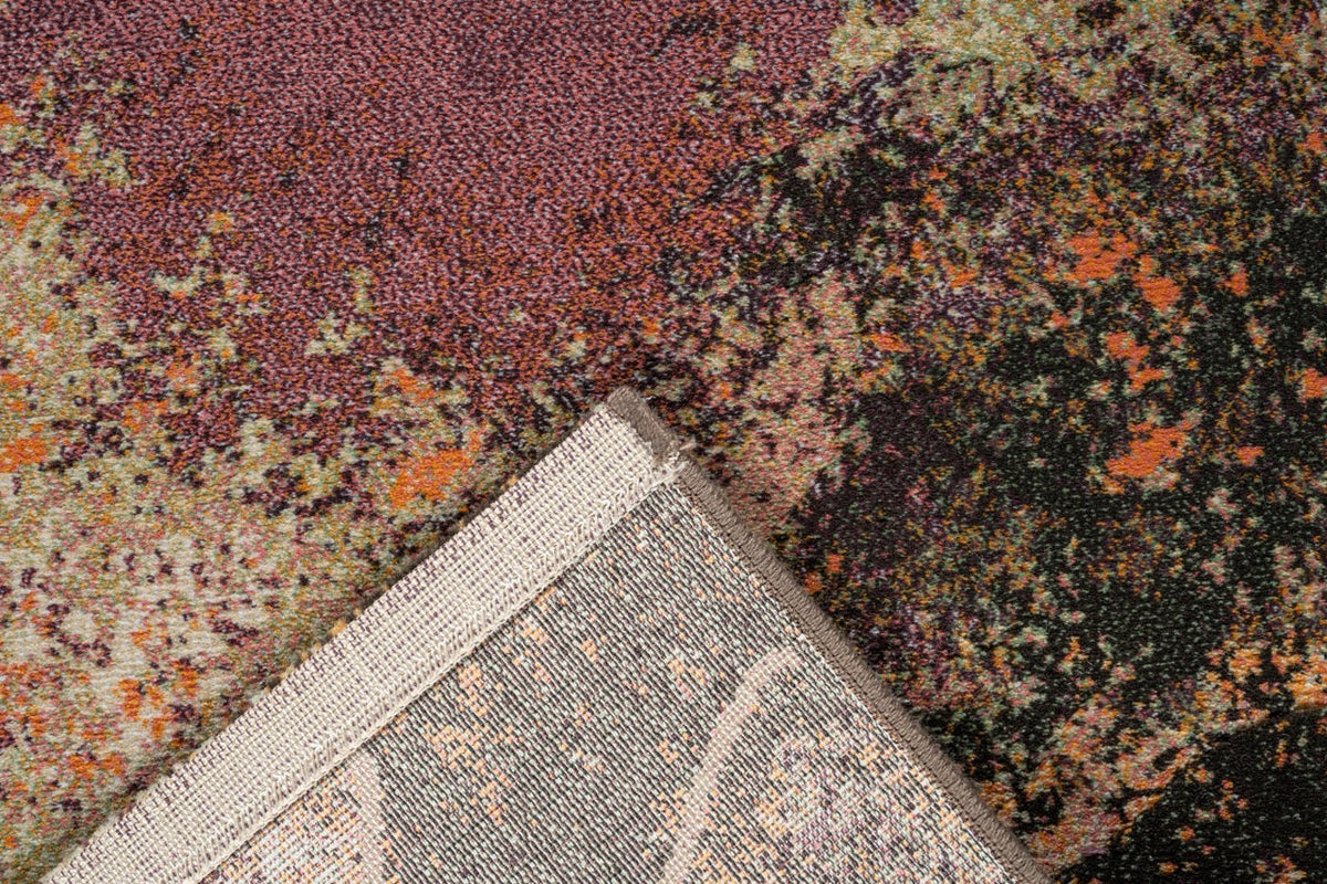 Coin replié montrant l'envers tissé du tapis violet Tapison Home Torino 063.0934.7274