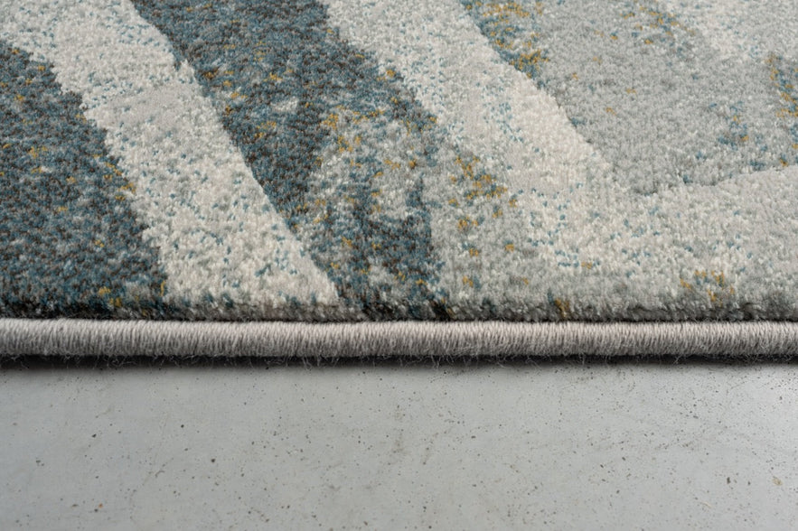 Vue de profil du velours ras et de la bordure du tapis Tapison Home Torino 063.0990.4299