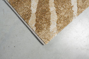 Détail d'un angle du tapis Tapison Home Torino 063.0990.7299 en ocre et ivoire
