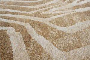 Gros plan sur le velours ras et dense du tapis Tapison Home Torino 063.0990.7299