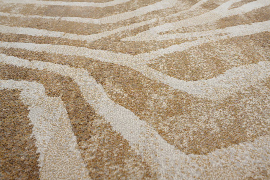 Gros plan sur le velours ras et dense du tapis Tapison Home Torino 063.0990.7299