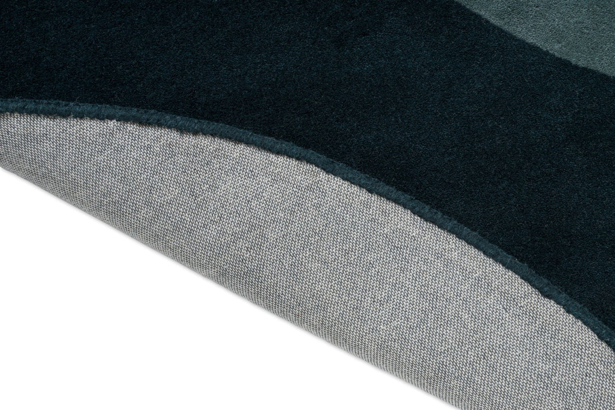 Tapis Brink & Campman Element Lane Blue, détail du bord replié et du dos