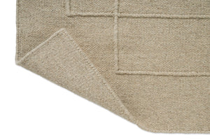 Tapis Brink & Campman Senso Level Natural, détail de l'angle replié et de l'envers