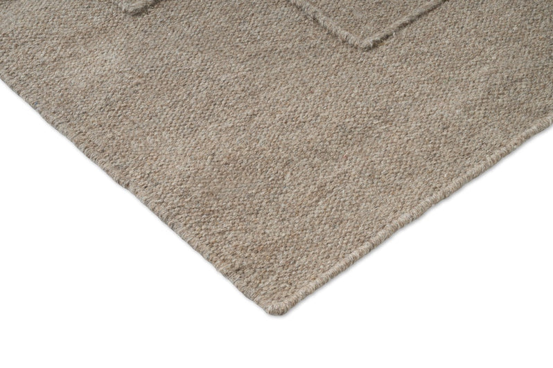 Tapis Brink & Campman Senso Level Soft Taupe, détail de l'angle et du tissage