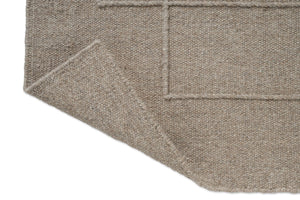 Tapis Brink & Campman Senso Level Soft Taupe, détail de l'angle replié et de l'envers