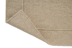 Tapis Brink & Campman Senso Planes Natural, détail de l'angle replié et de l'envers