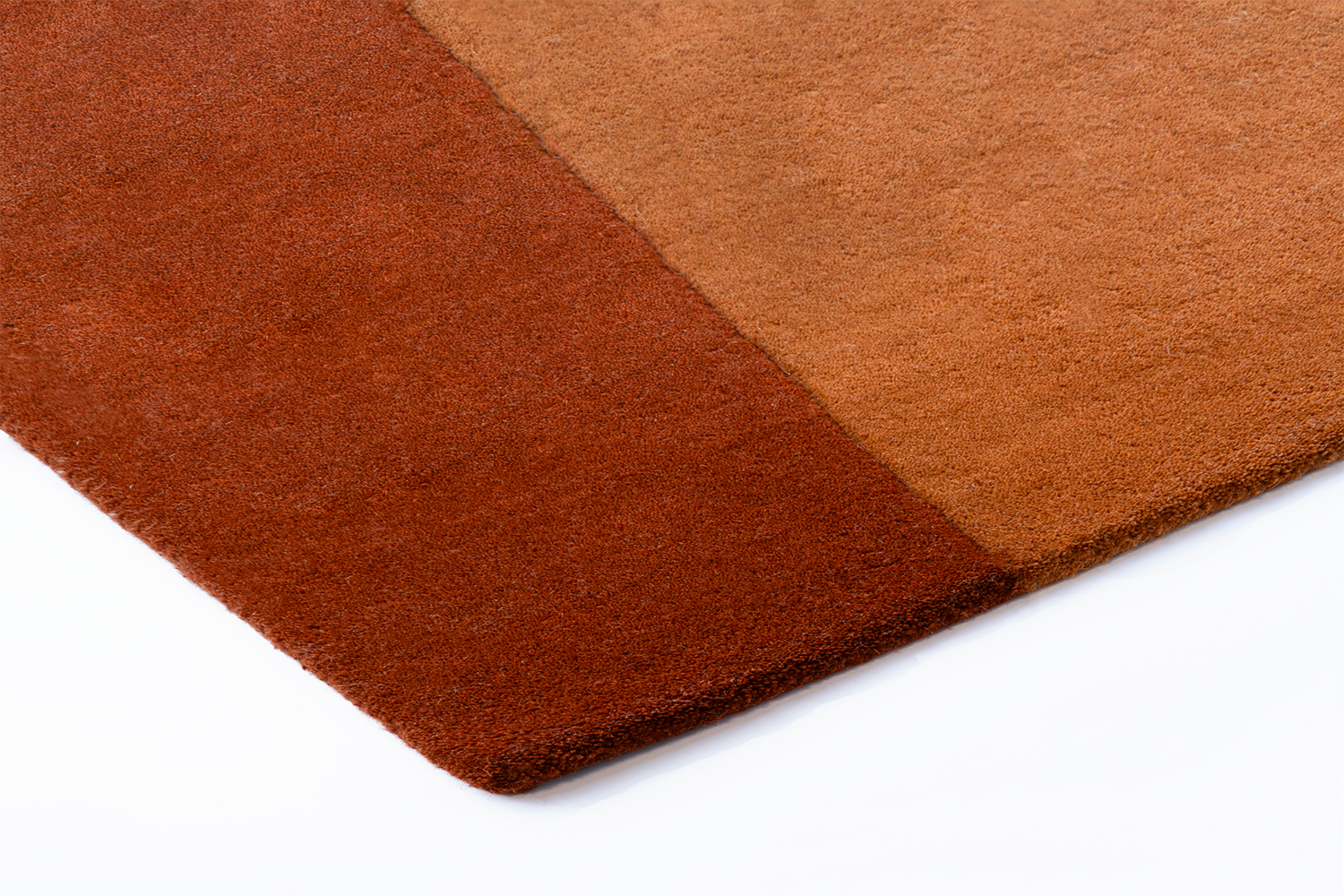  Close-up texture of Acsento Lipari Terra wool rug showing hand-tufted quality