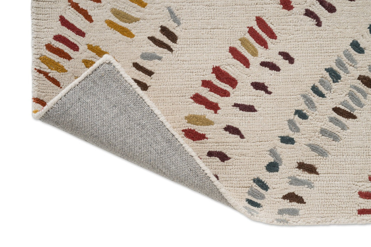 Tapis Harlequin Frescoes Amber, détail de l'angle replié et du dos