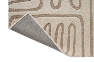 Tapis Harlequin Hollow Pebble, détail de l'angle replié et du dos