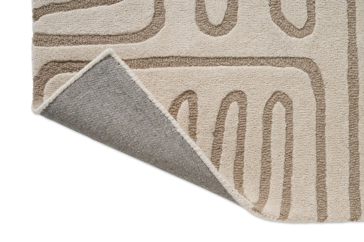 Tapis Harlequin Hollow Pebble, détail de l'angle replié et du dos