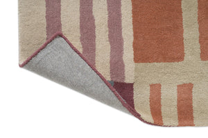 Tapis Harlequin Monolith Cinnabar Amber, détail de l'angle replié et du dos