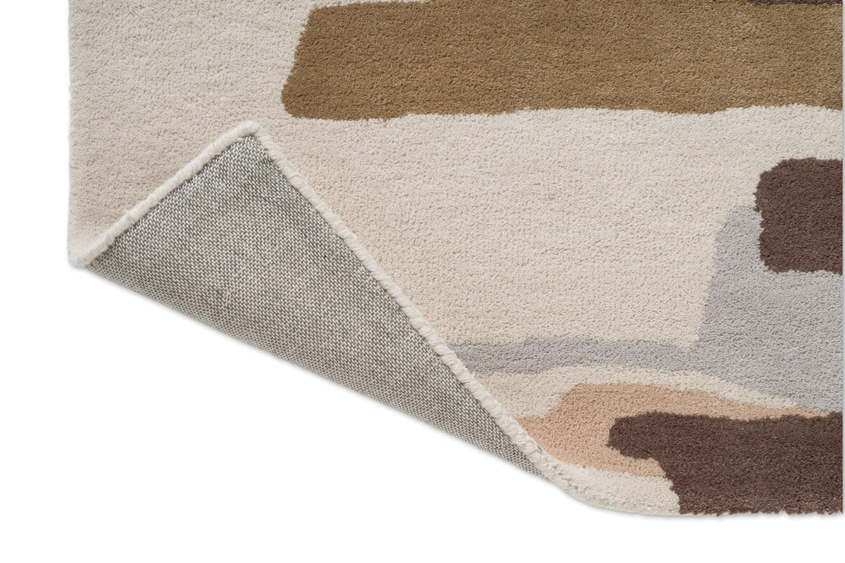 Tapis Harlequin Zeal Taupe, détail de l'angle replié et du dos