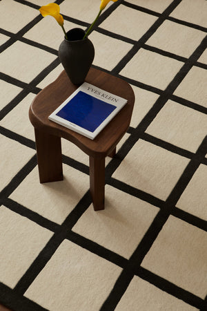  Close-up texture of Layered Avenue Checked Bone White wool rug showing hand-woven quality