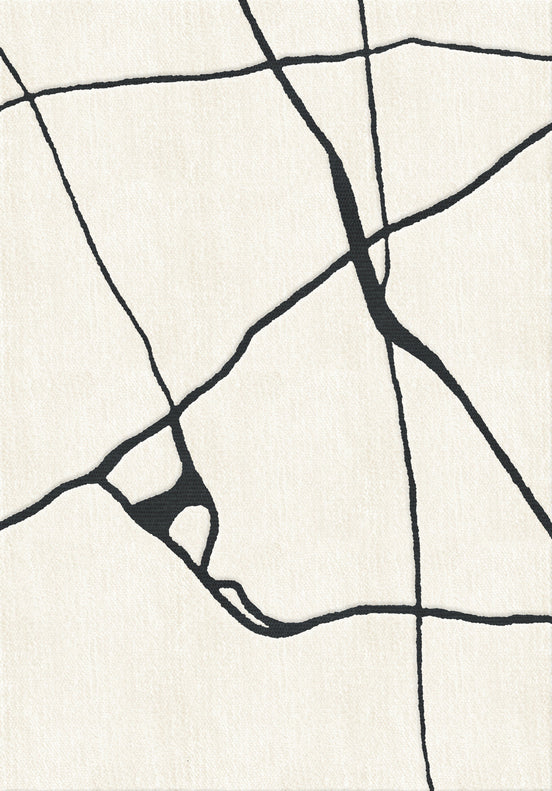 Layered Gotland Gute hand-woven wool rug with bold black and white abstract pattern - luxury 2.5cm pile