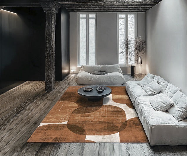 Tapis Acsento Bubbles Cognac cognac aux formes arrondies orange brûlé et caramel sur crème, dans un intérieur