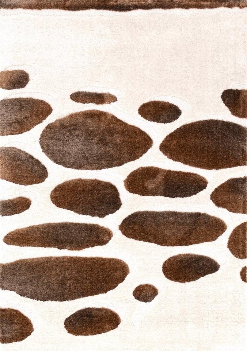 Tapis Acsento Step Stones ivoire aux galets bruns en poils longs, vue de dessus