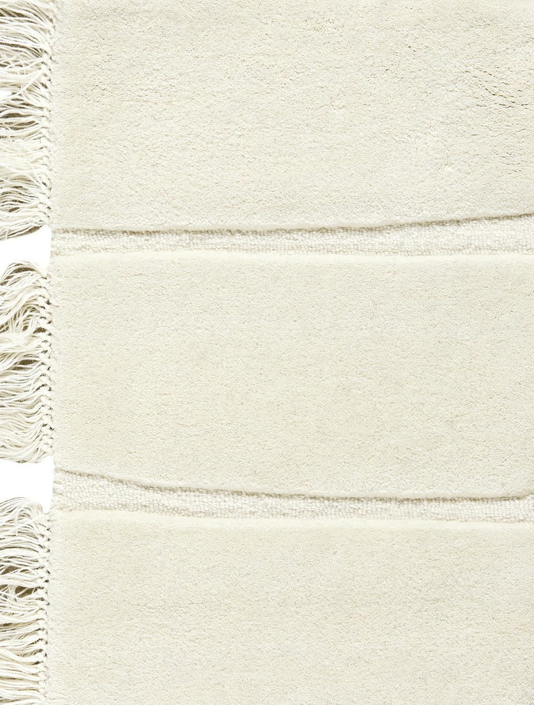 Massimo Atoll Cream tapis tufté en laine, détail des franges