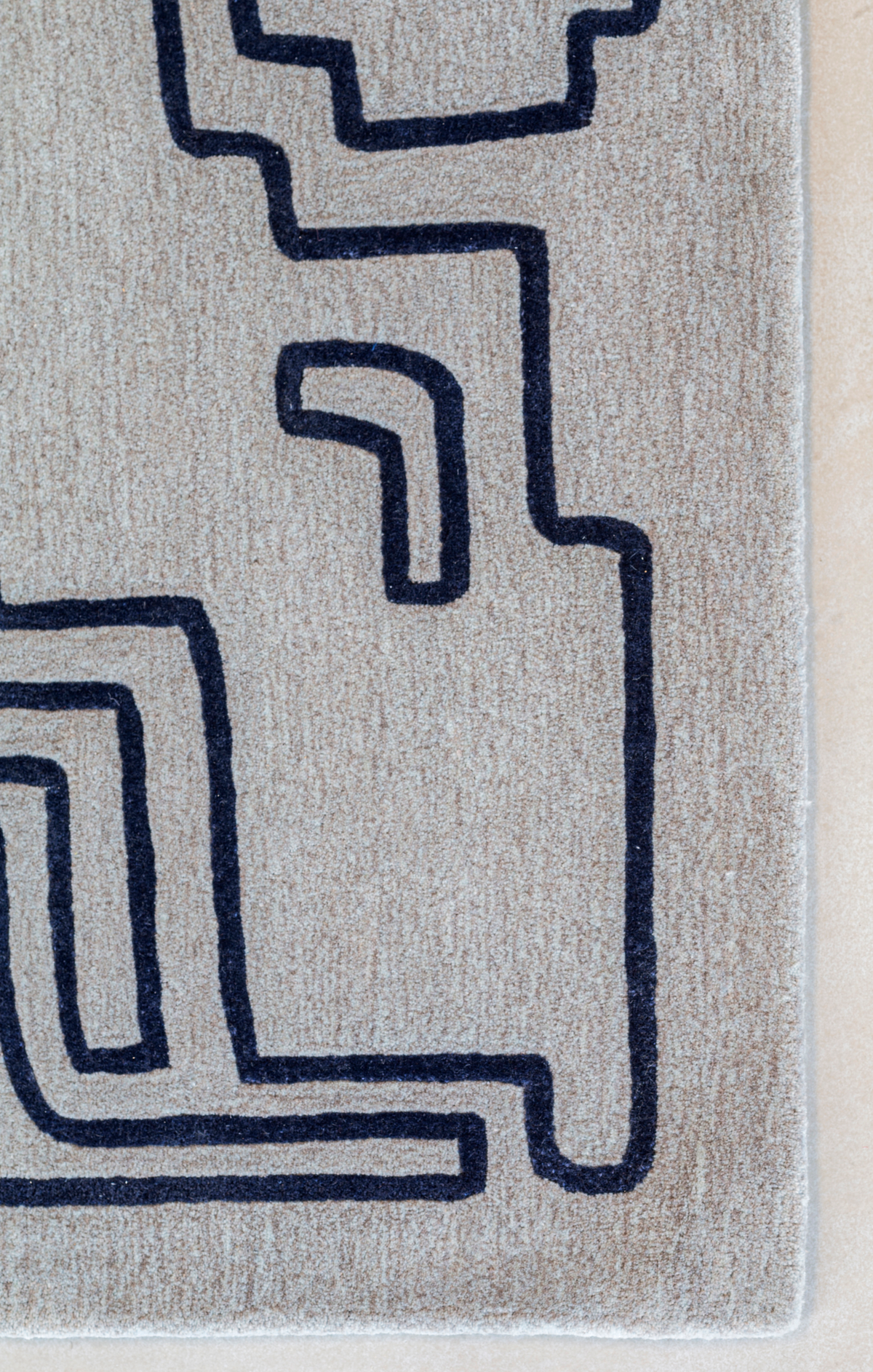 Massimo Structures Fragment 2 tapis bleu, détail du coin